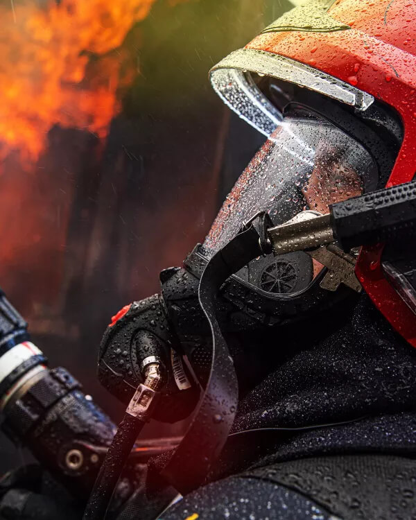 A close up photo of a firefighter in action